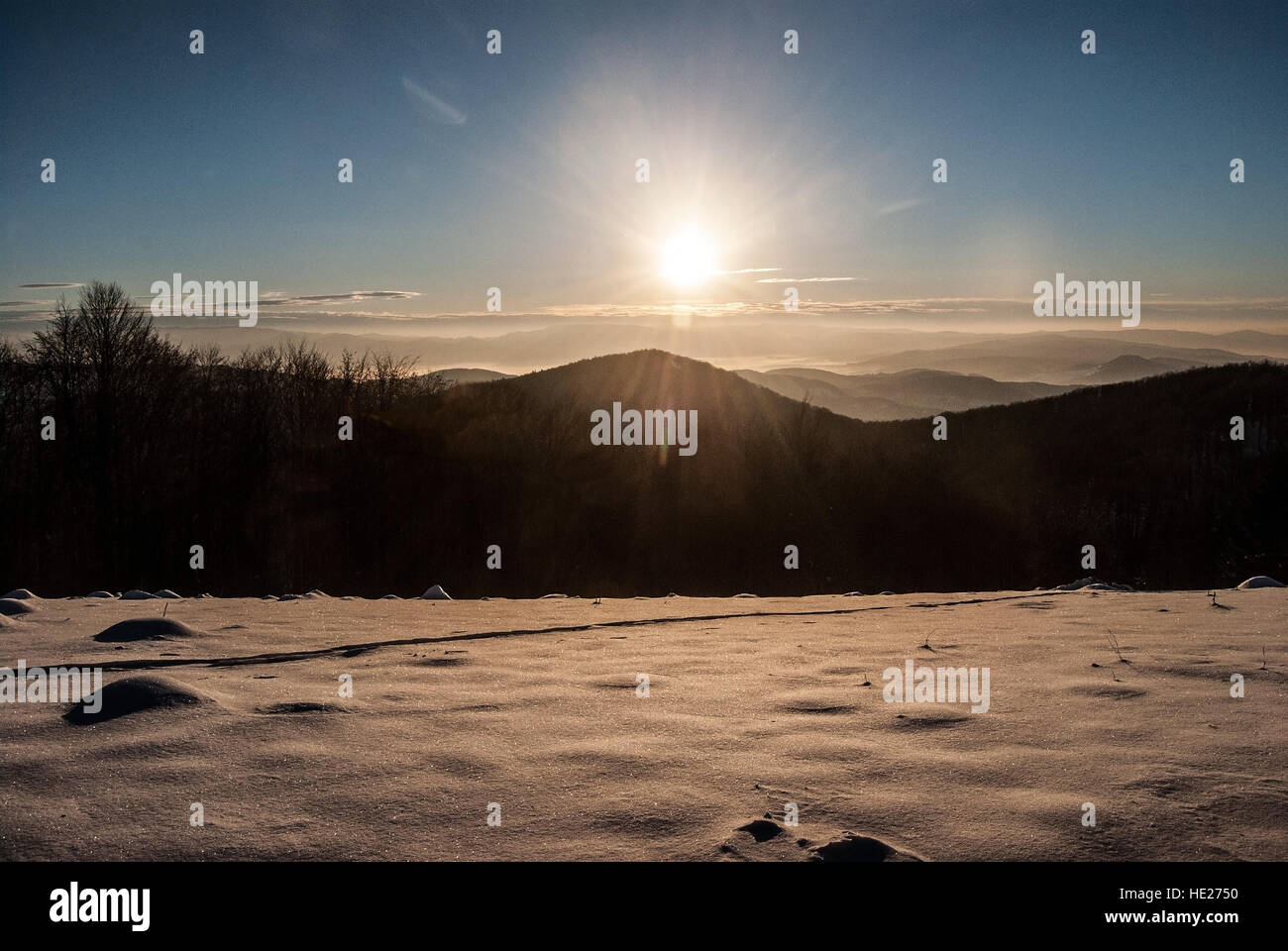 winter sunrise with hills, snow, sunlight, clear ska and misty in valley  from Revan hill in southernmost part of Mala Fatra mountains in Slovakia  Stock Photo - Alamy