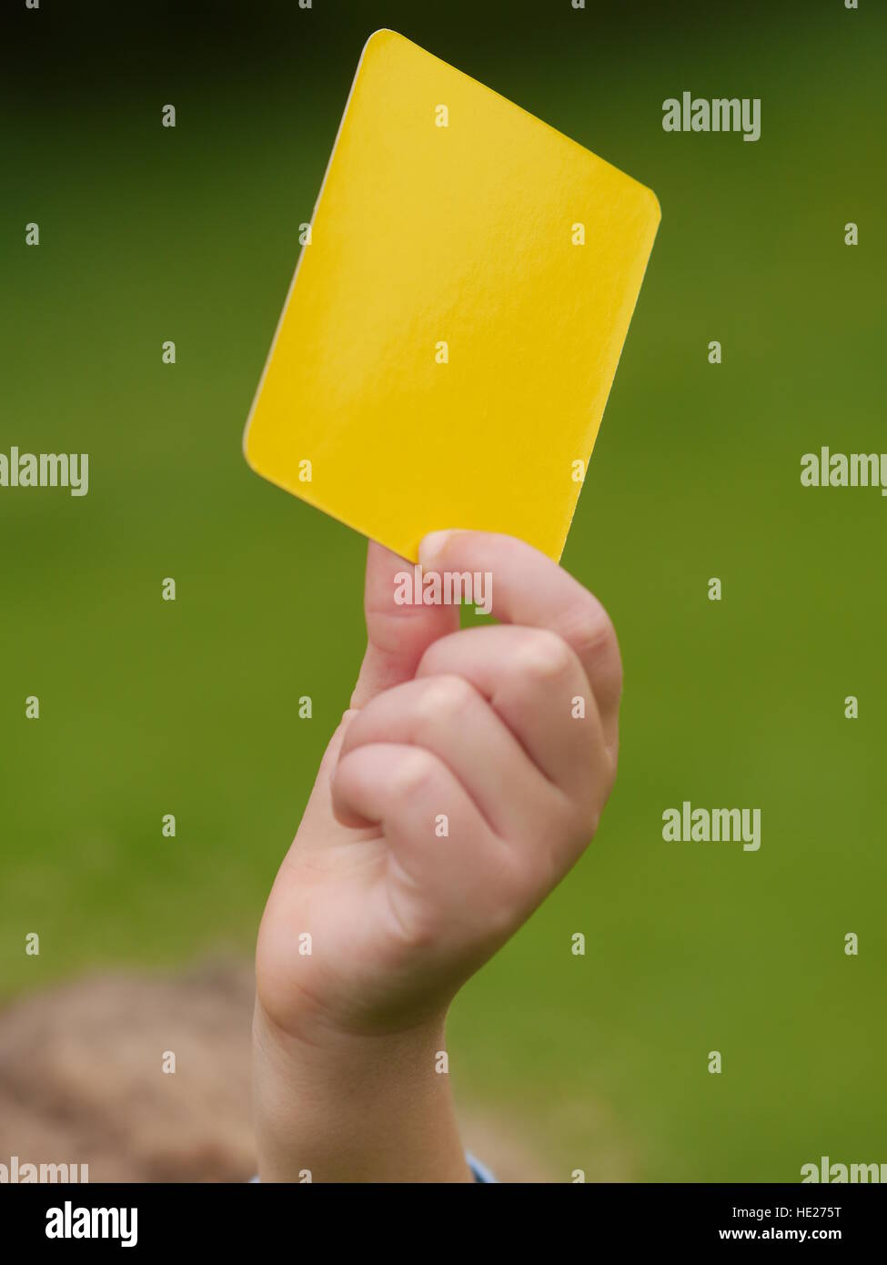 referee hand with yellow card Stock Photo