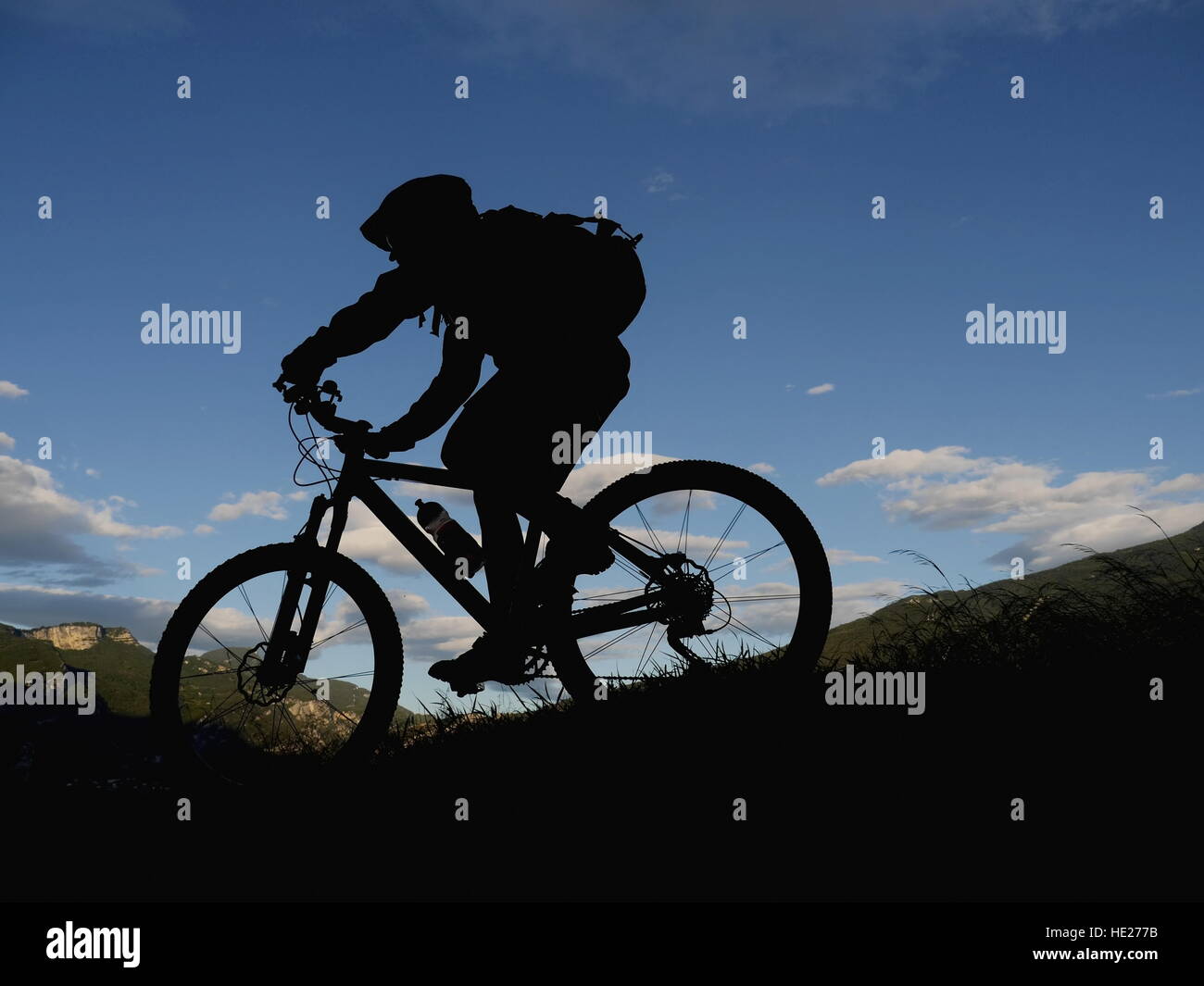 silhouette mountain biker Stock Photo - Alamy