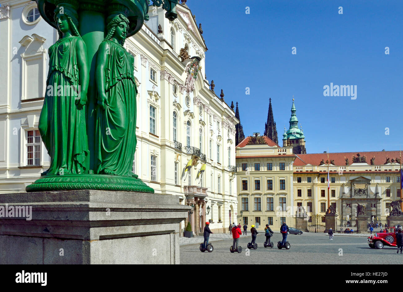 Prague, Czech Republic. Lamppost in Hradcanske namesti / Castle Square. Sternbersky palac / Sternberg Palace) behind. Segway tour Stock Photo