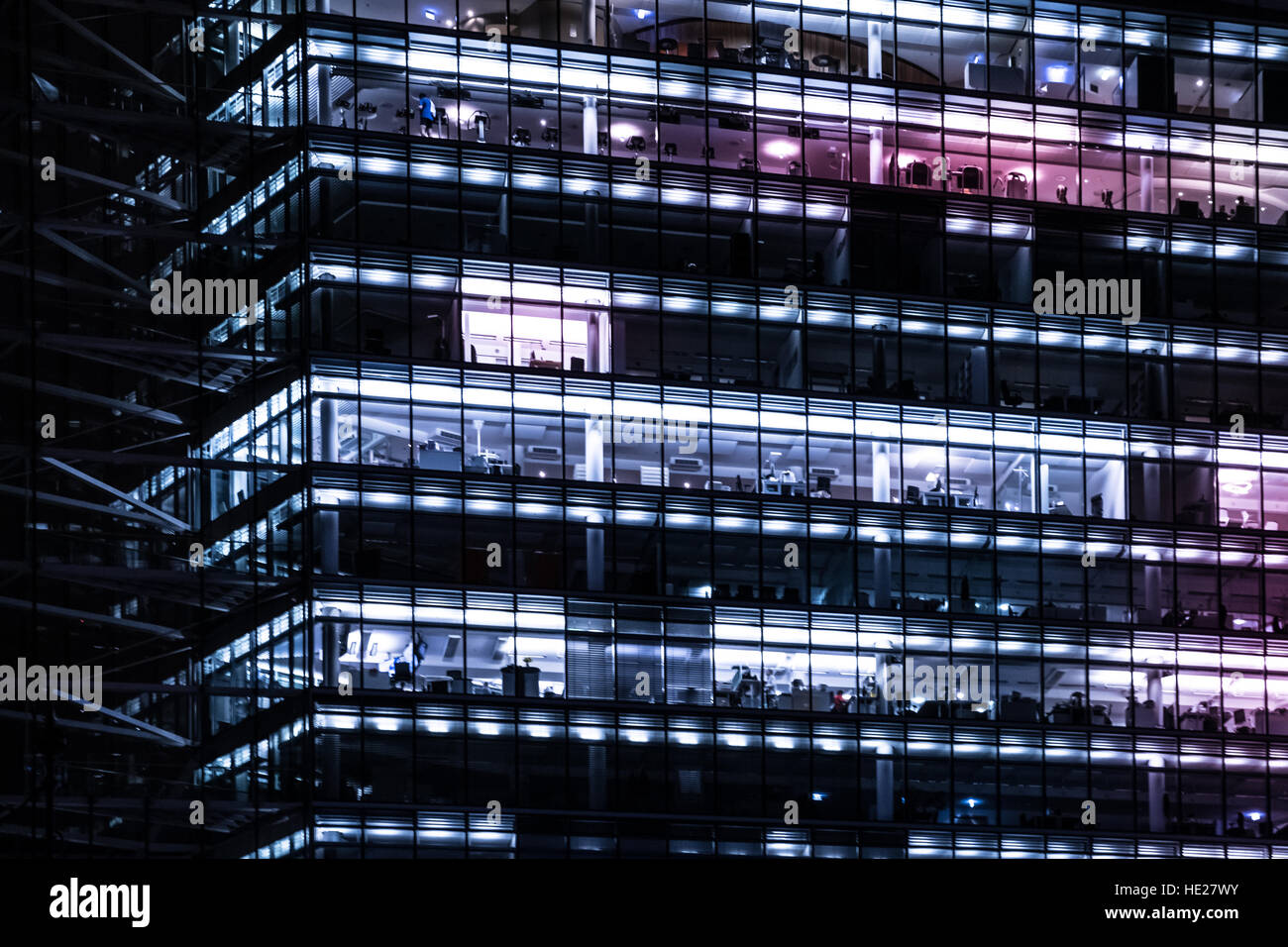 office building facade at night, city lights Stock Photo