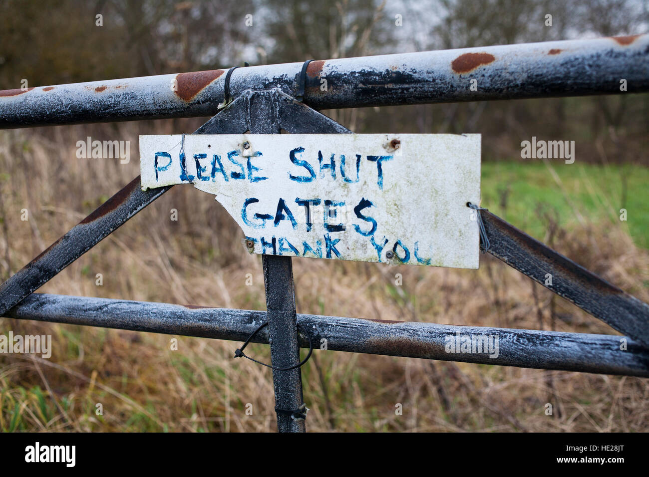 Please close the gate sign. Stock Photo