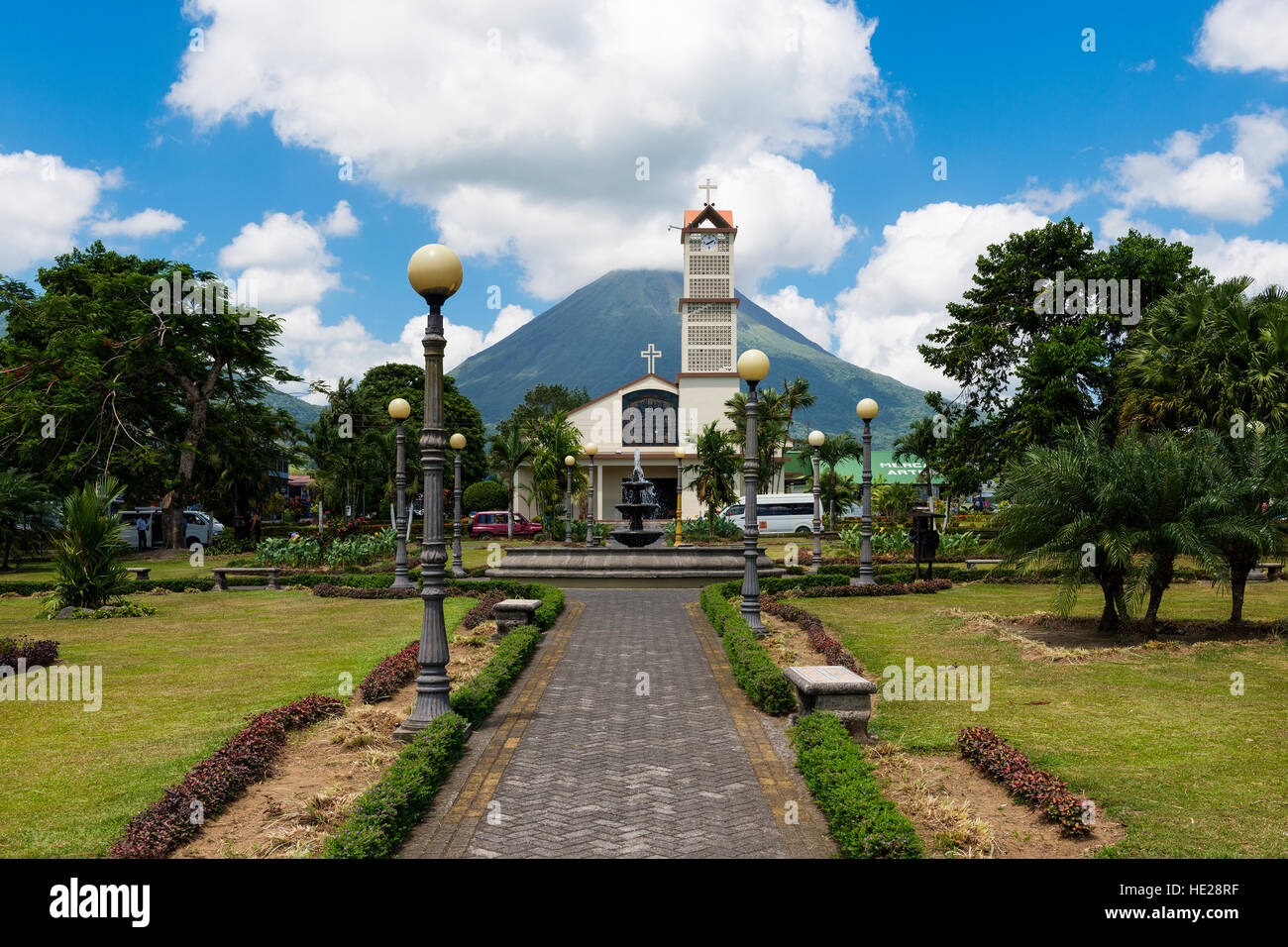 La Fortuna, Costa Rica - March 31, 2014: View of the town of La Fortuna in Costa Rica with the Arenal Volcano on the back. Stock Photo