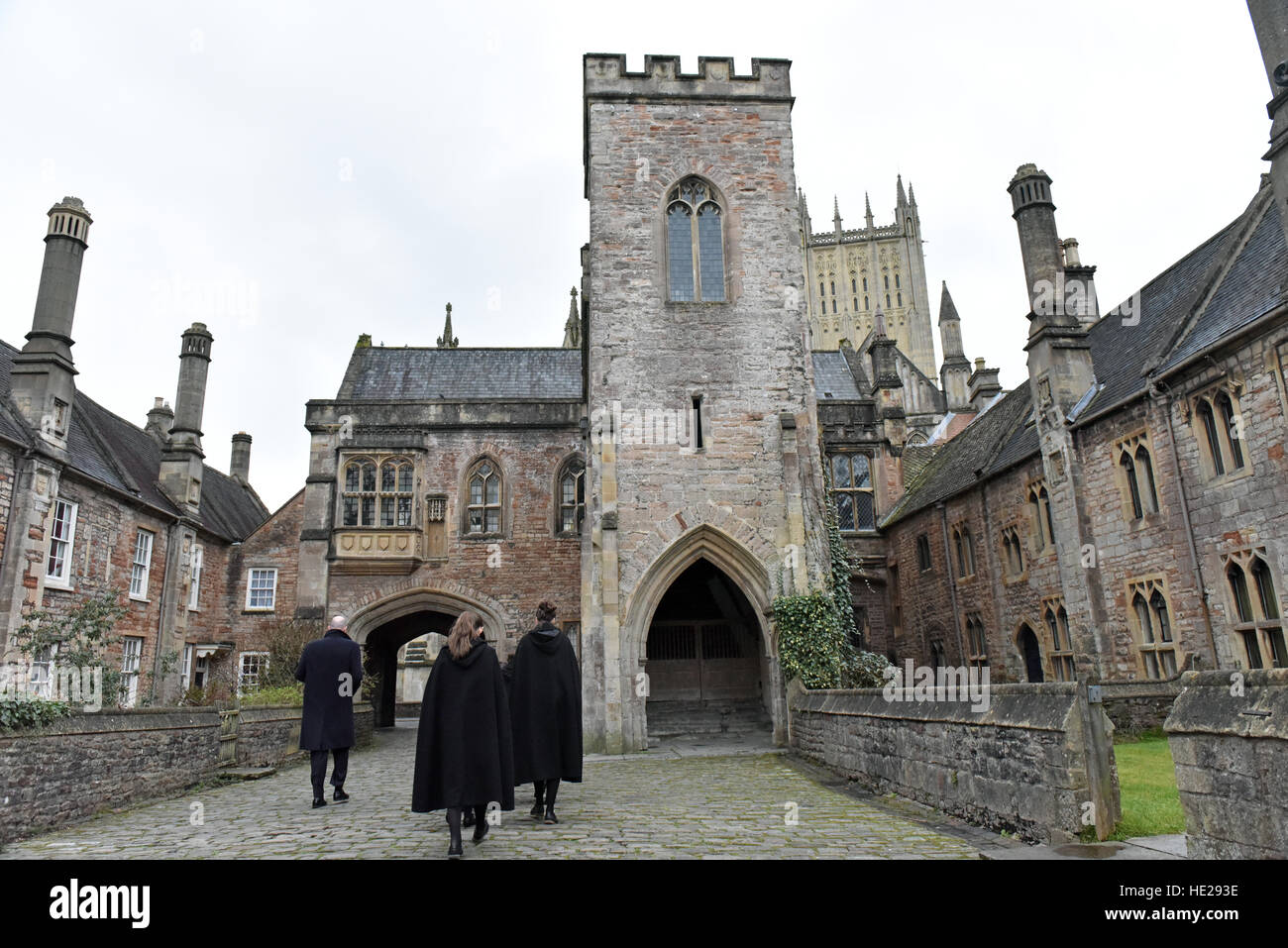 Choristers from Wells Cathedral Choir walking along Vicars Close with Wells Cathedral in the background, on Easter Sunday. Stock Photo