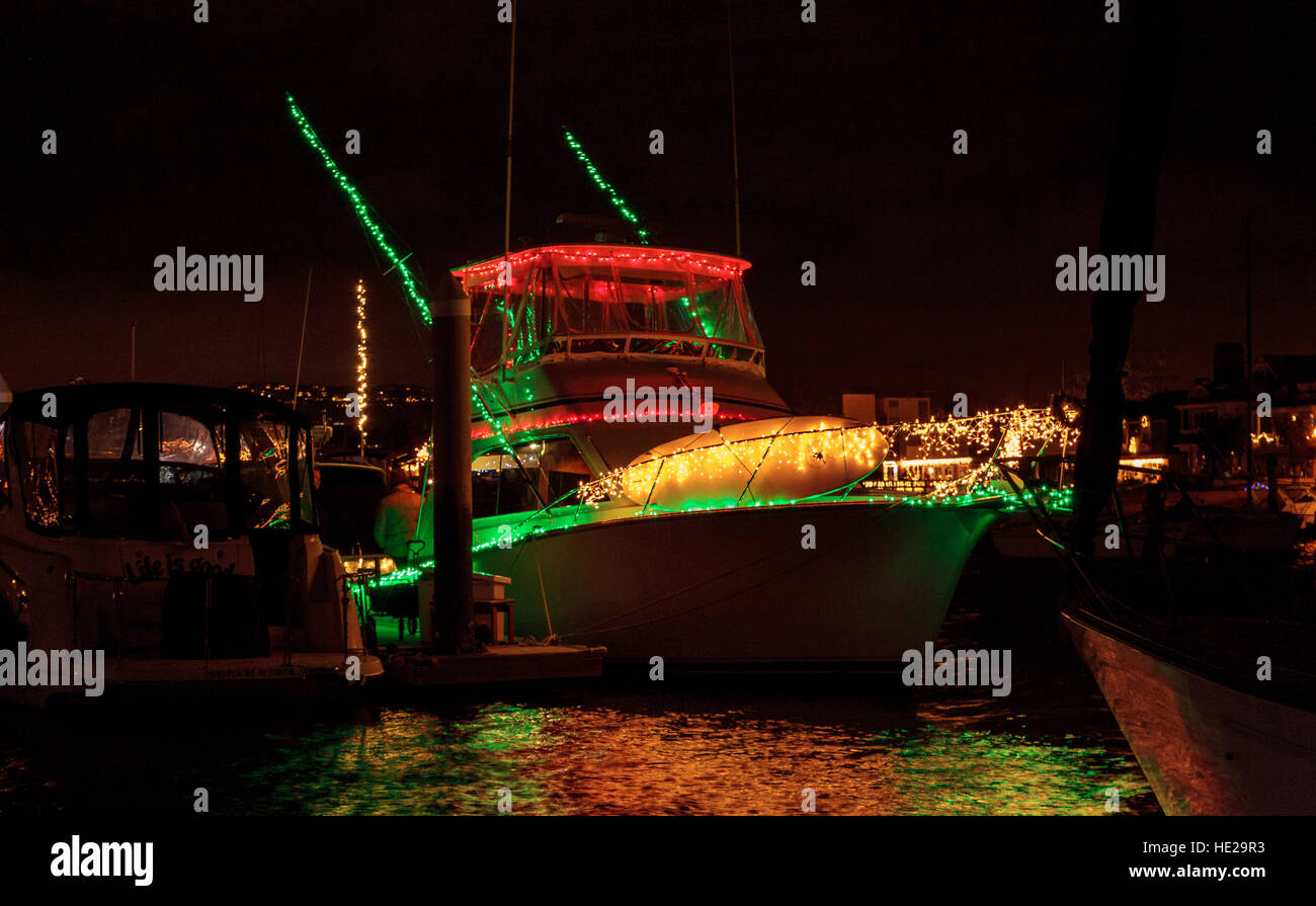 Colorful holiday lights on sailboats and ships in the Balboa Harbor for