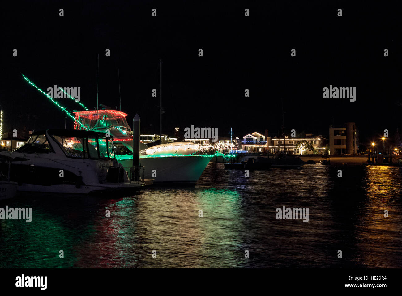 Colorful holiday lights on sailboats and ships in the Balboa Harbor for