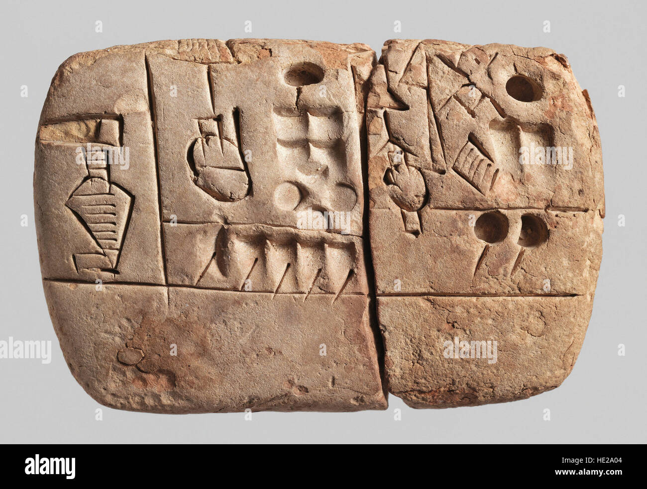6010. Early clay Pictographic cuneiform tablet, Mesioitamia, Uruk, c. 3100-2900 BC. Text deals with administrative accounts concerning grain distribut Stock Photo