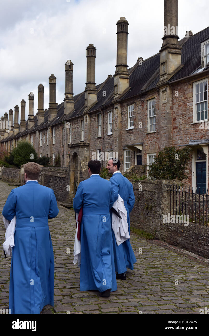 Vicars Choral, Wells Cathedral Choir, walking to their homes in Vicars Close after  evensong at the Cathedral on Easter Day. Stock Photo