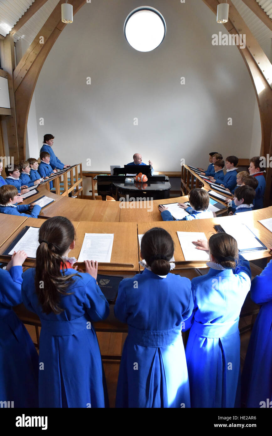 Choristers from Wells Cathedral Choir on Easter Day preparing for evensong, practicing or  in the song school at Wells Cathedral Stock Photo