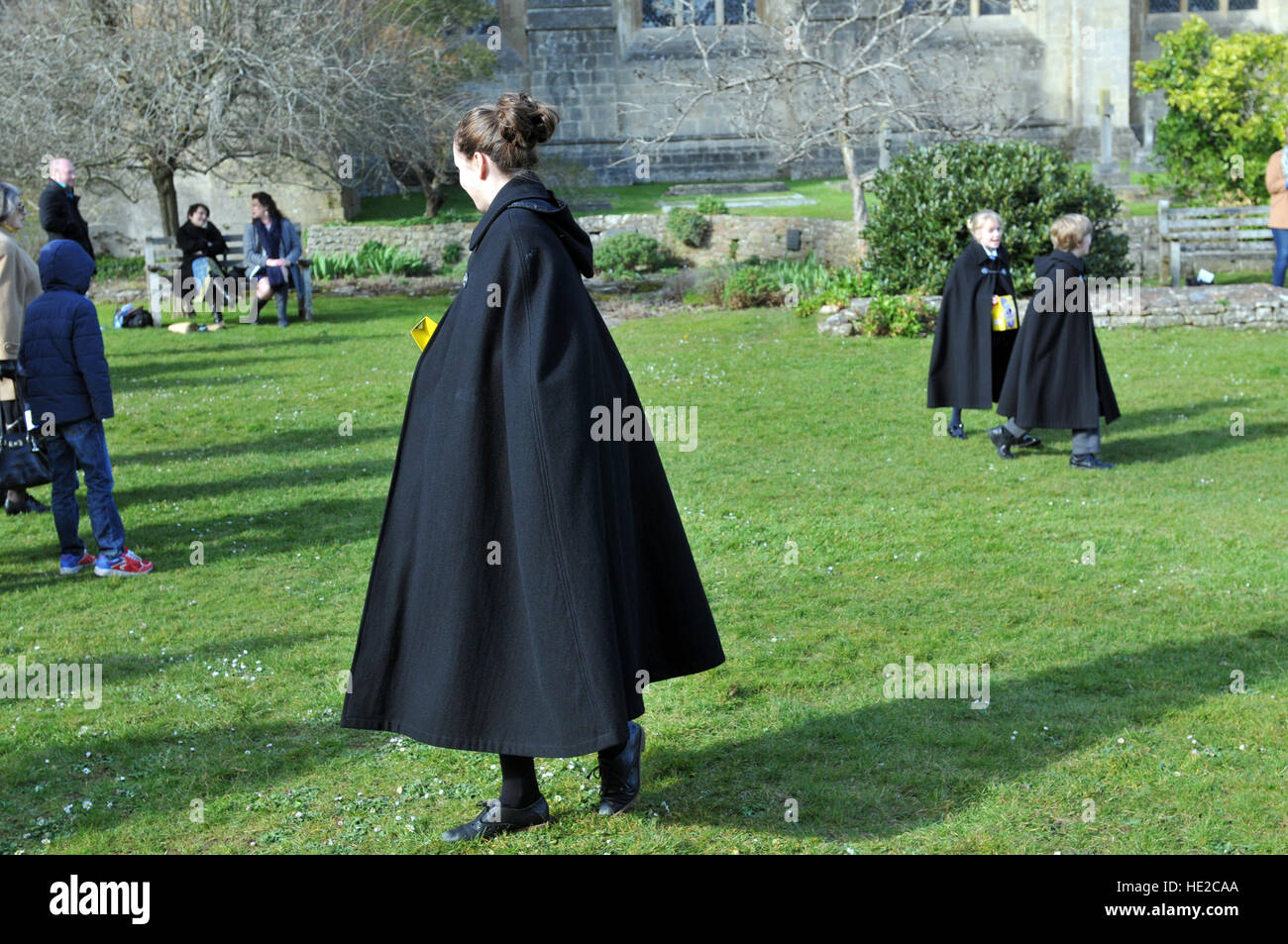 Choristers from Wells Cathedral Choirin Easter Egg hunt to celebrate end of Easter chorister duties in Camery Garden. Stock Photo