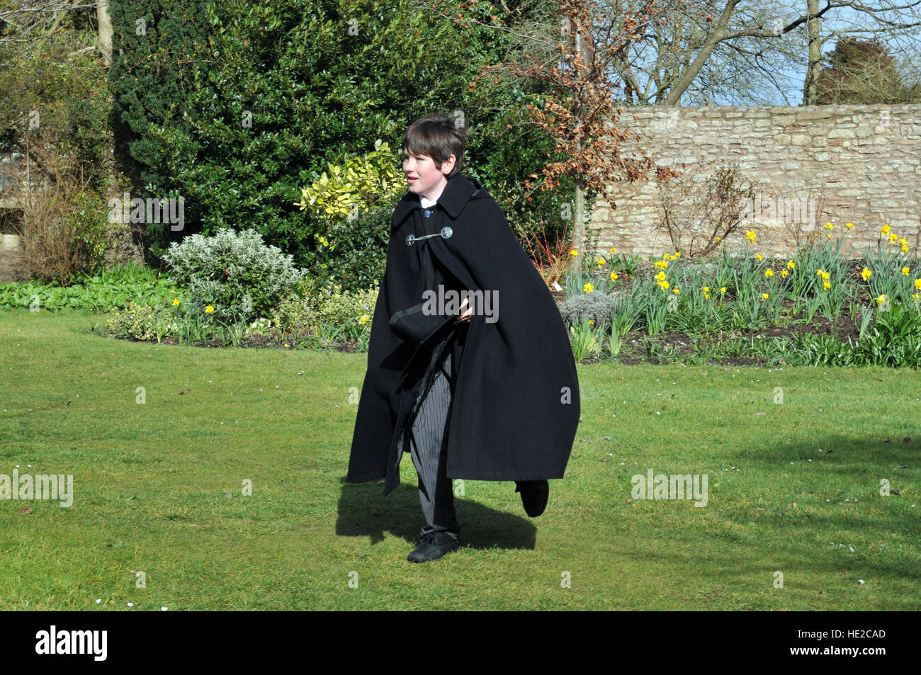 Choristers from Wells Cathedral Choir taking part in Easter egg hunt after the end of Easter chorister duties. Stock Photo