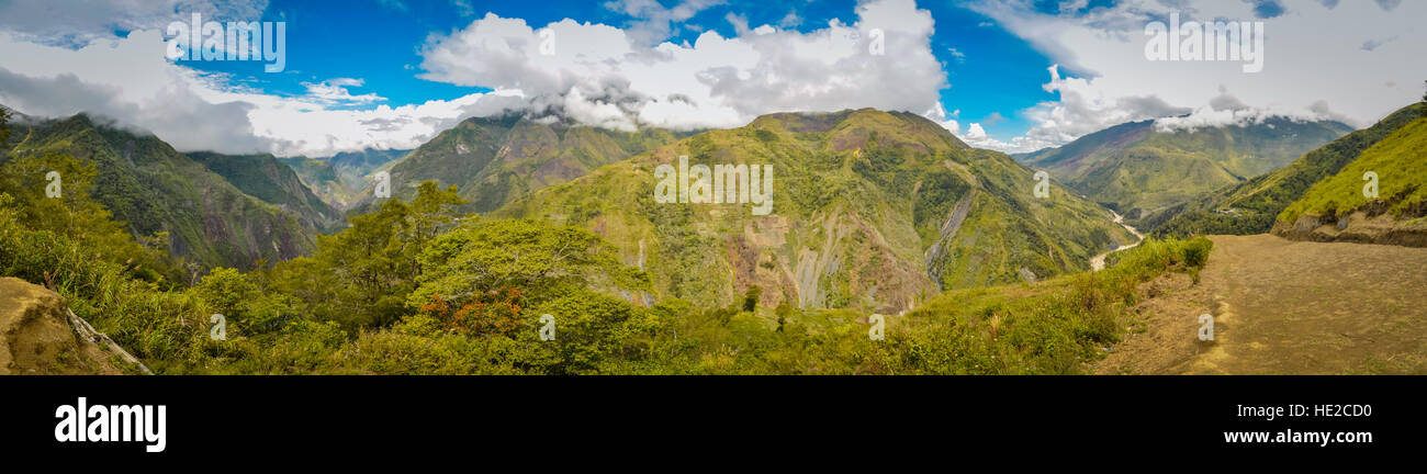 Panoramic view of mountains in Dani circuit near Wamena, Papua, Indonesia. In this region, one can only meet people from isolated local tribes. Stock Photo