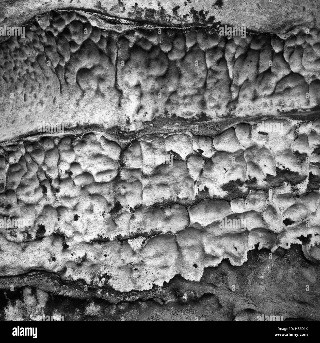 Eroded sandstone rock texture in black and white color Stock Photo