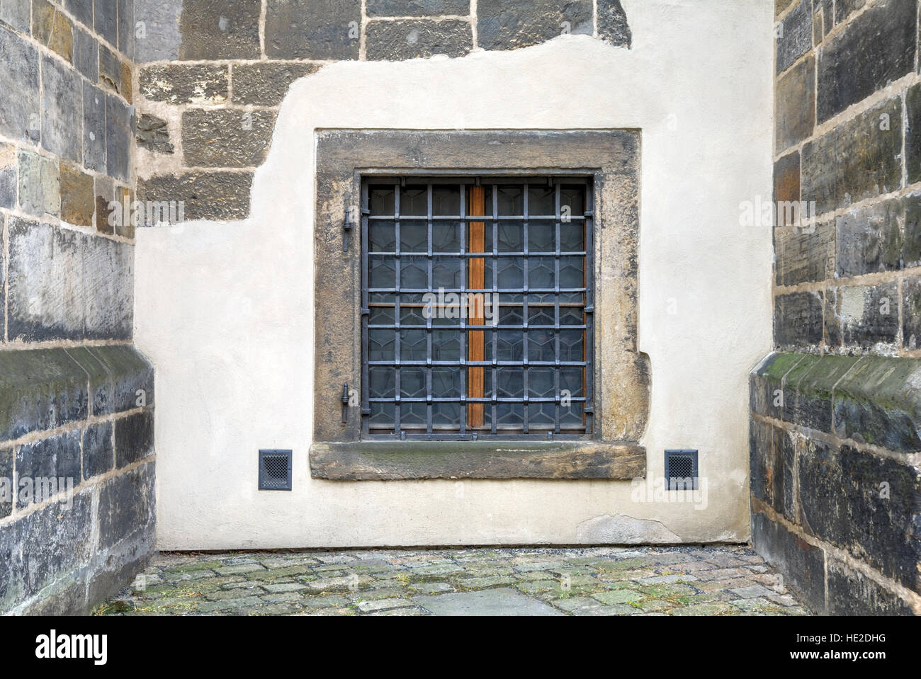 Window with bars set in an old fortress stone wall Stock Photo - Alamy