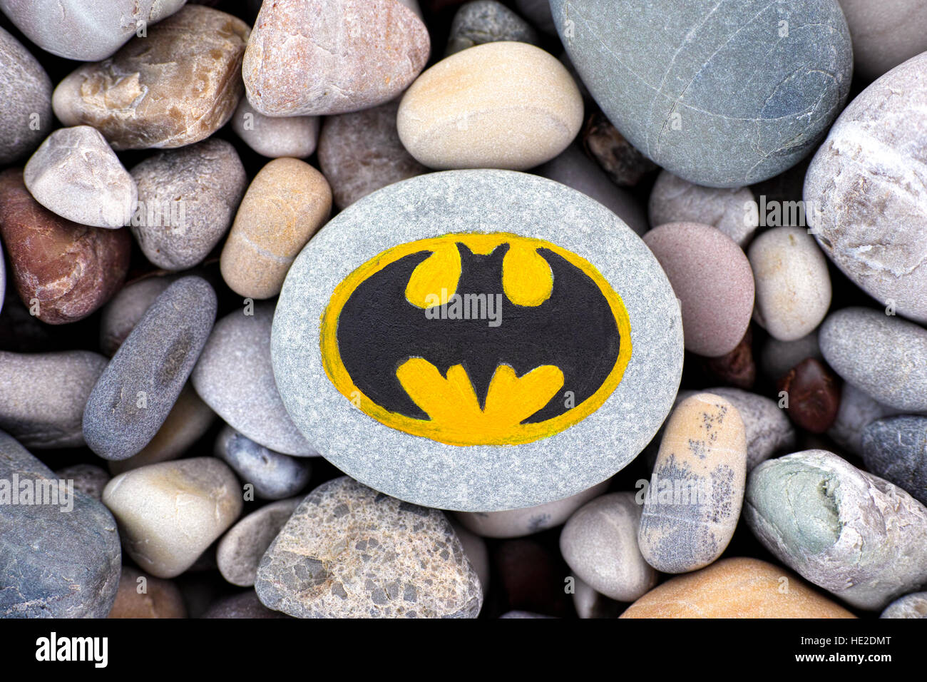 Paphos, Cyprus - November 22, 2016 Sign Batman painted on a pebble with stones background. Stock Photo