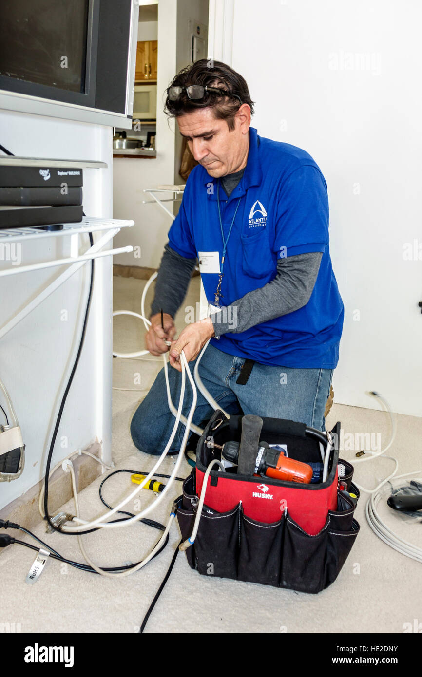 miami florida beach atlantic broadband hispanic man cable tv cable installer job
