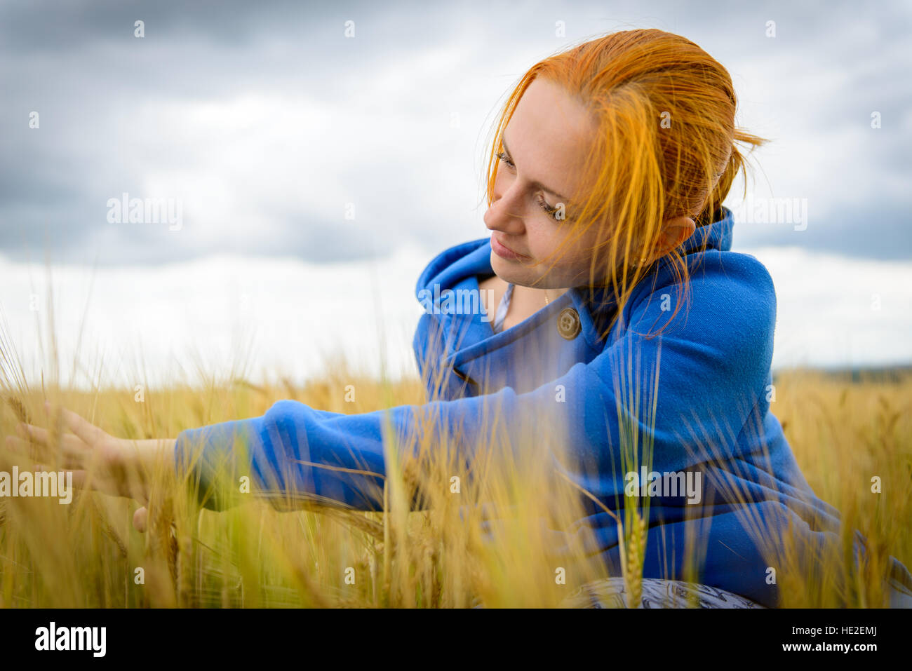 Young woman in wheat field Stock Photo - Alamy