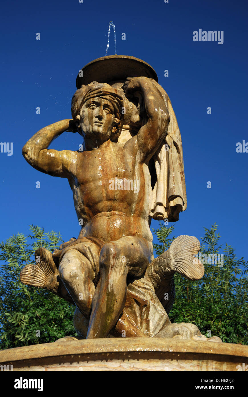 Baroque Fountain Man Statue in Flower Garden in the town of Kromeriz, Czech Republic Stock Photo