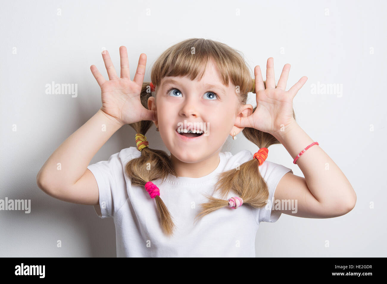 little girl teasing Stock Photo Alamy
