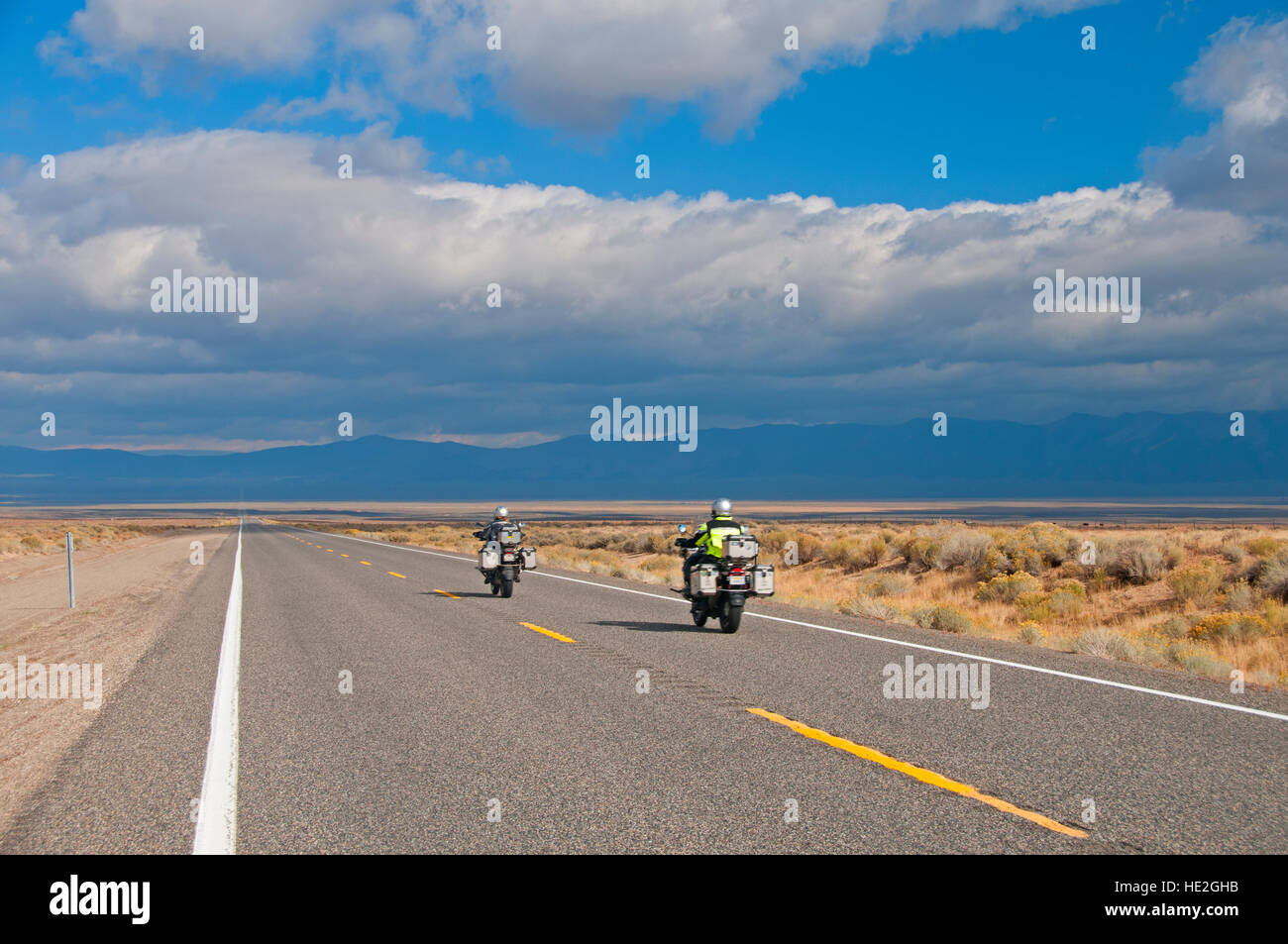 Two motorcyclists on Lincoln Highway 50, the Loneliest Road in America, just West of Austin, Nevada Stock Photo