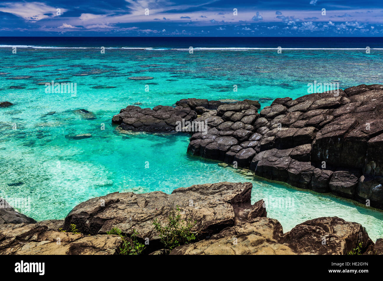 Black Rock, a tropical beach surrounded by black rocks, Rarotonga Stock