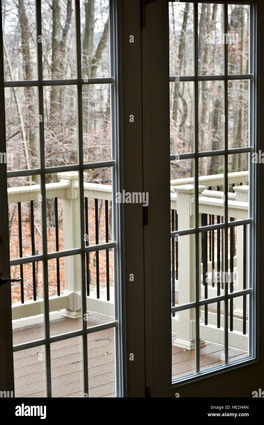 A view a wooded landscape from inside a home Stock Photo