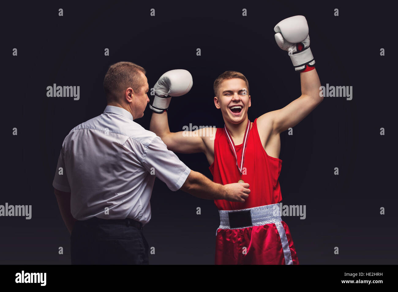 Boxing referee gives medal to young boxer Stock Photo Alamy