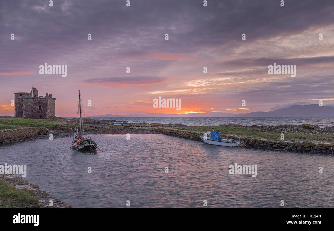 Portencross Castle and Two Boats in the small harbour Stock Photo