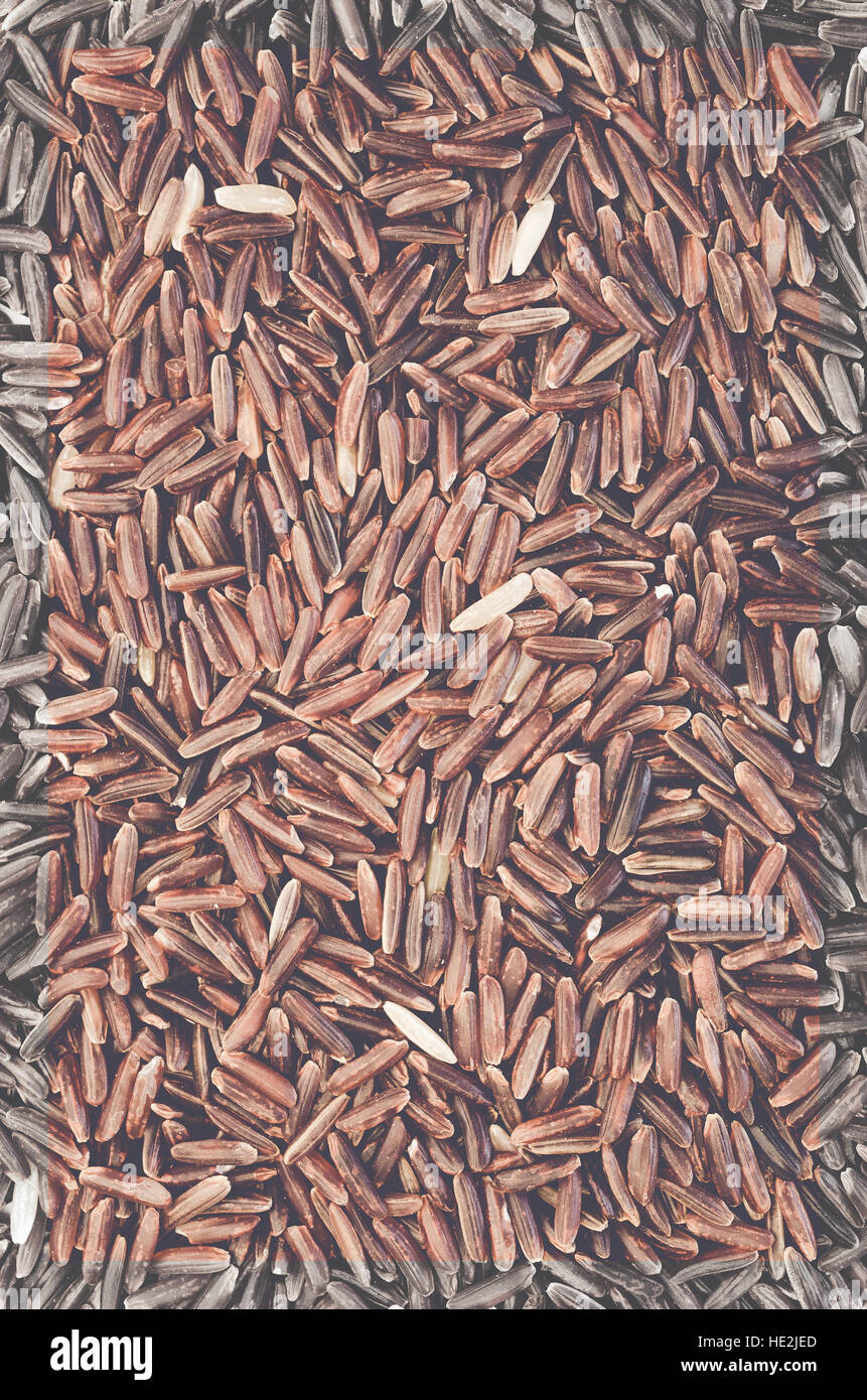 red rice grains full frame top perspective view Stock Photo - Alamy