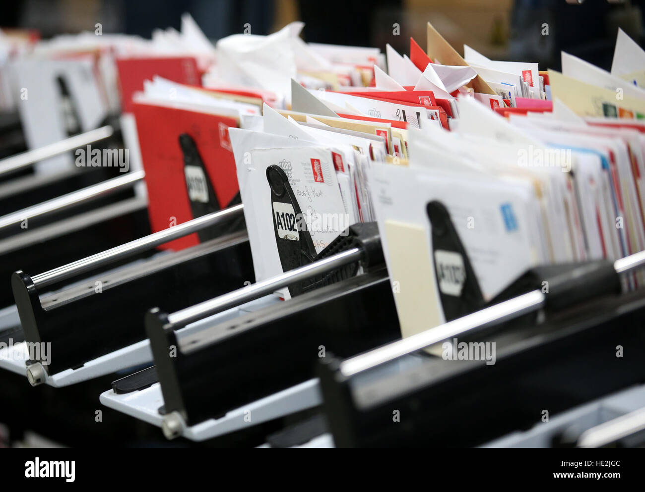 A Royal Mail worker sorts mail at the Royal Mail's Sorting Office in