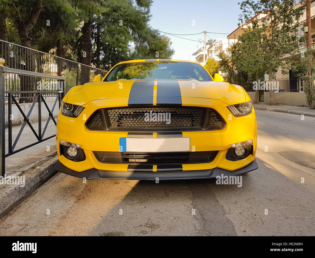 Front of a yellow sport car with black stripes. Stock Photo