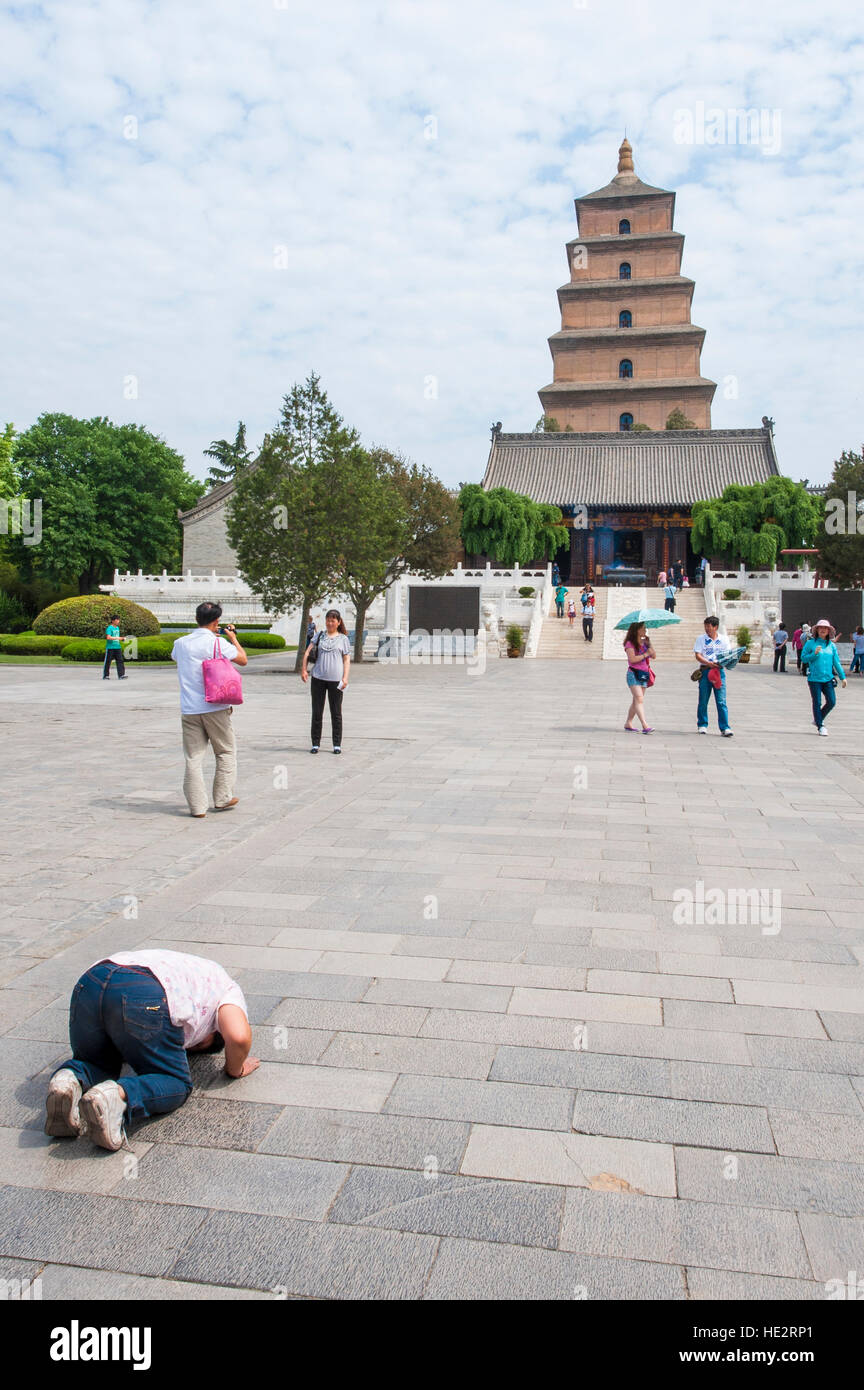 Worshiper in courtyard Wild Goose Pagoda, Xian, China. Stock Photo