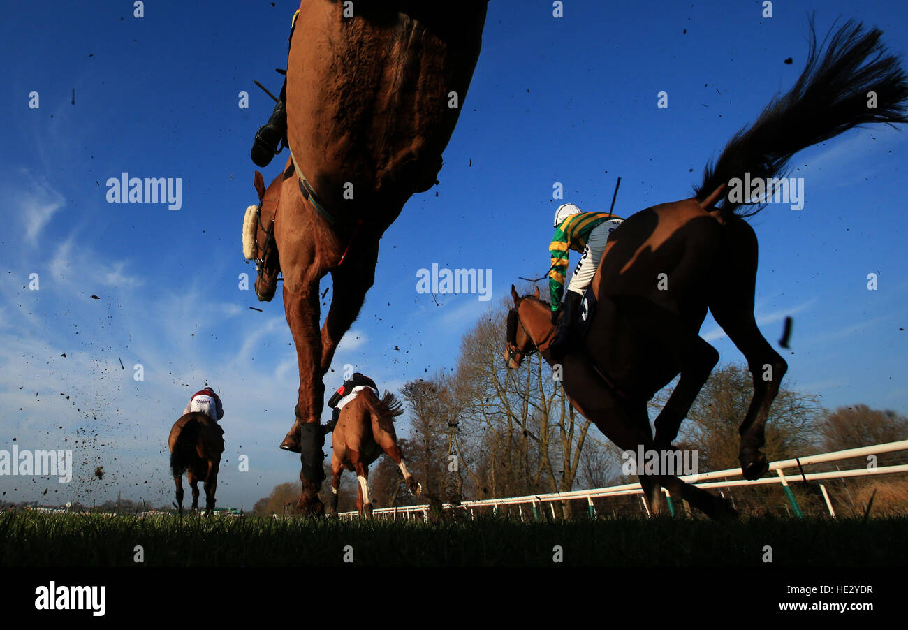 Horses jump the second to last jump in the Betfred 'Be Part Of The Action' Handicap Steeple Chase at Uttoxeter Racecourse. Stock Photo