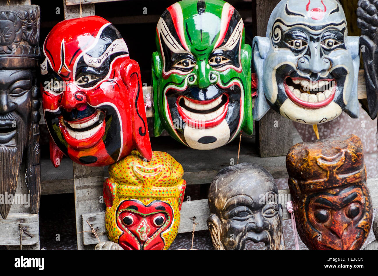 Souvenir masks in Yangshuo li river district, Guilin, China. Stock Photo