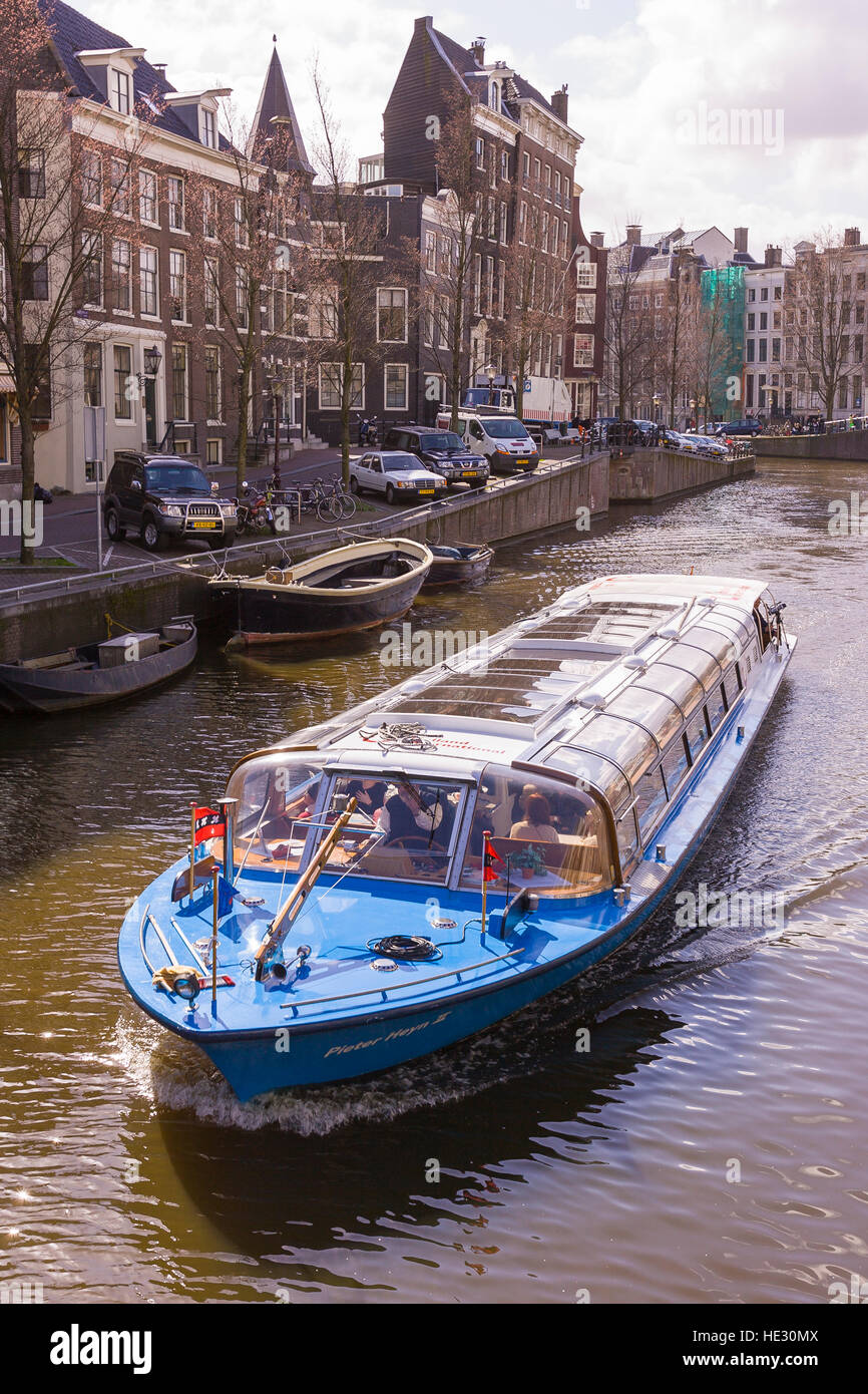 AMSTERDAM, NETHERLANDS - Canal boat. Stock Photo