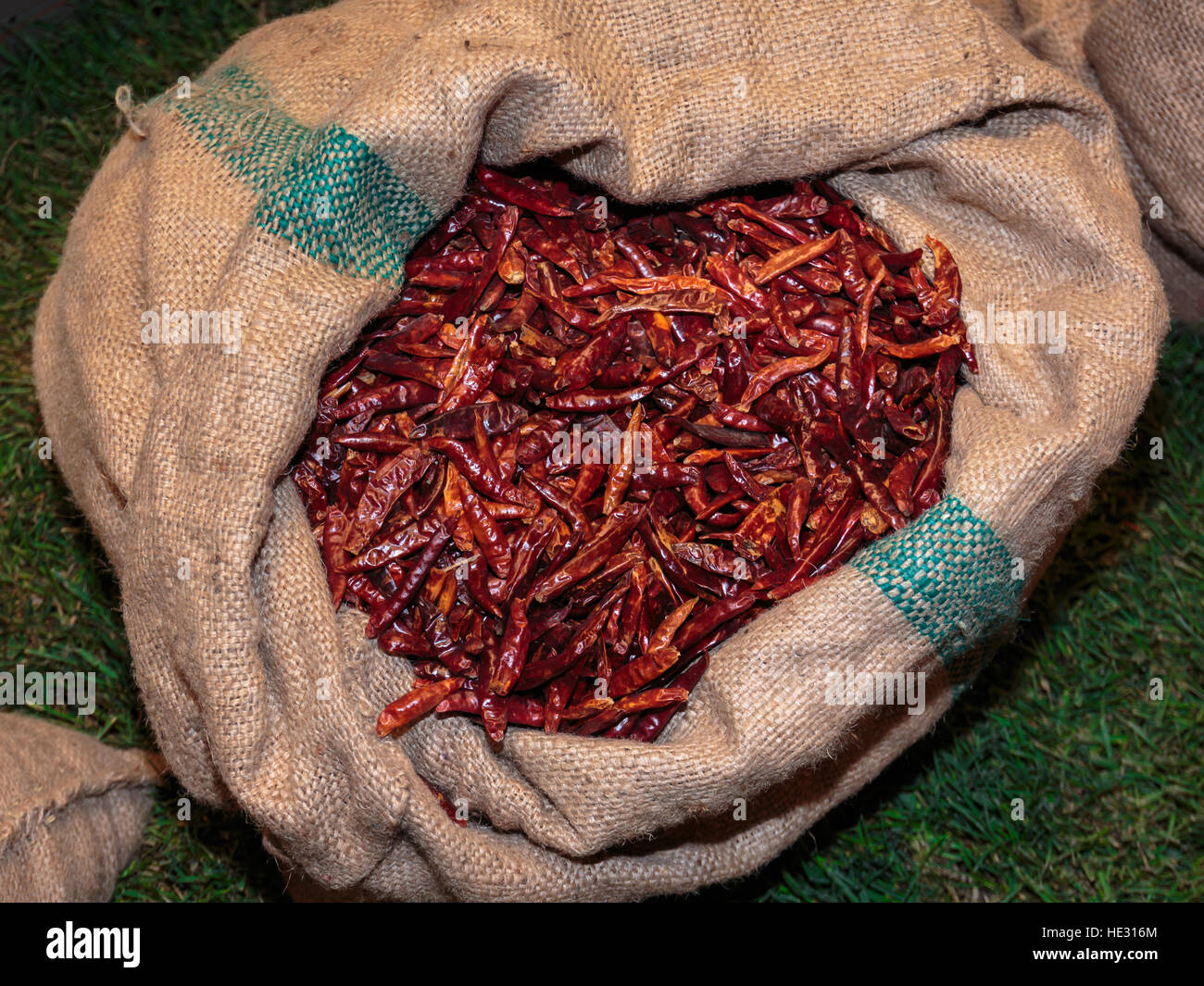 Red Dried Chili Peppers inside Burlap Sack Stock Photo - Alamy