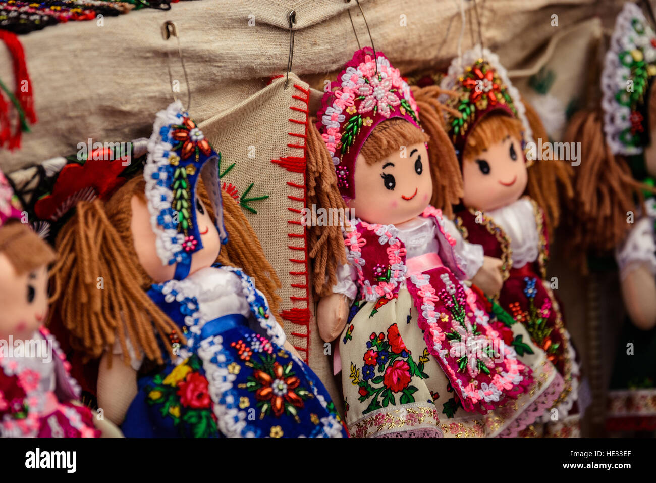 Traditional toys puppets dolls wearing Hungarian national costumes hanging Traditional Hungarian in the shop. Stock Photo