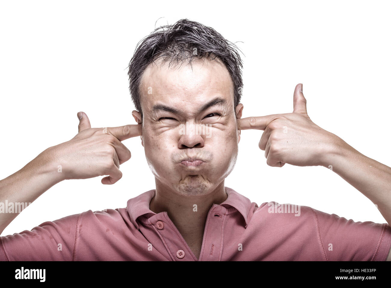Facial expression man with fingers in ears Stock Photo Alamy
