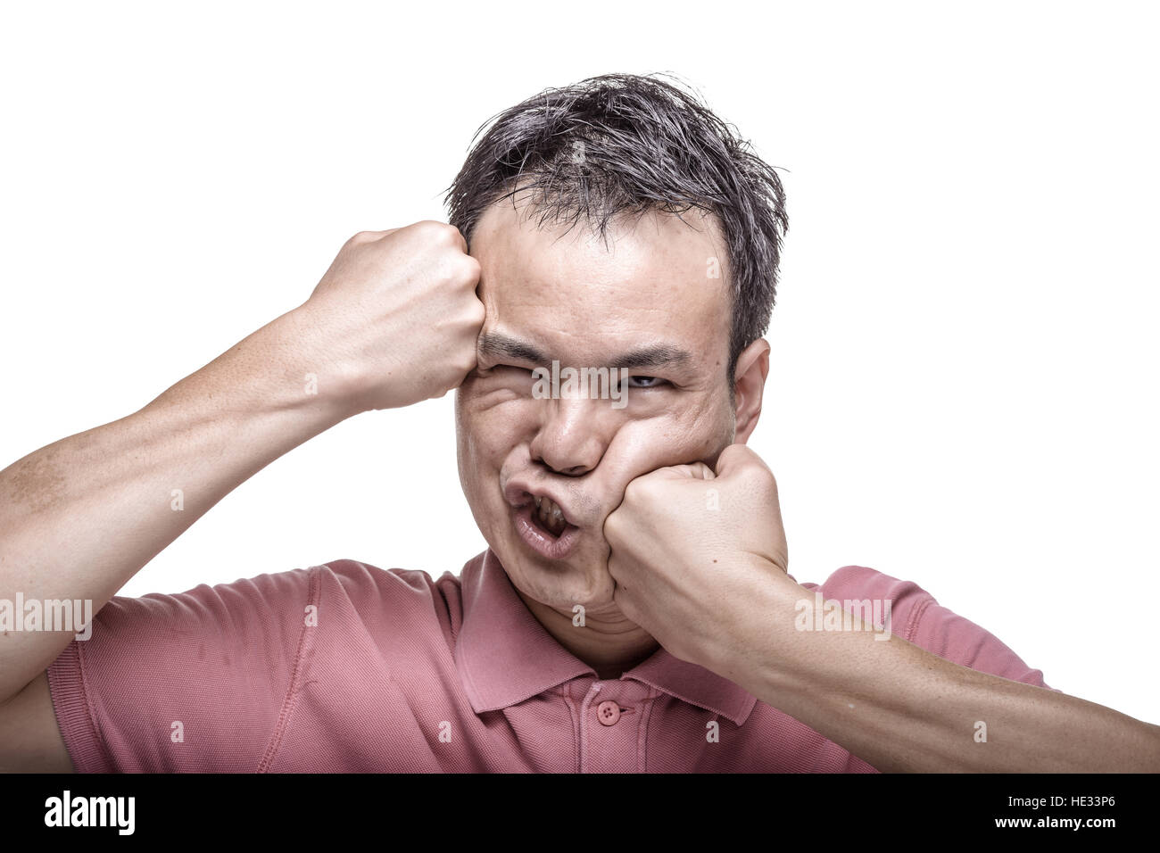 Facial expression : man punching his face Stock Photo