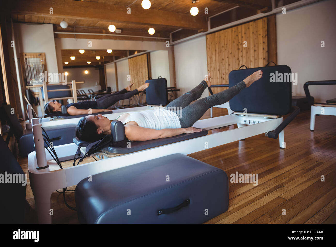 Women practicing pilates on reformer in fitness studio Stock Photo Alamy