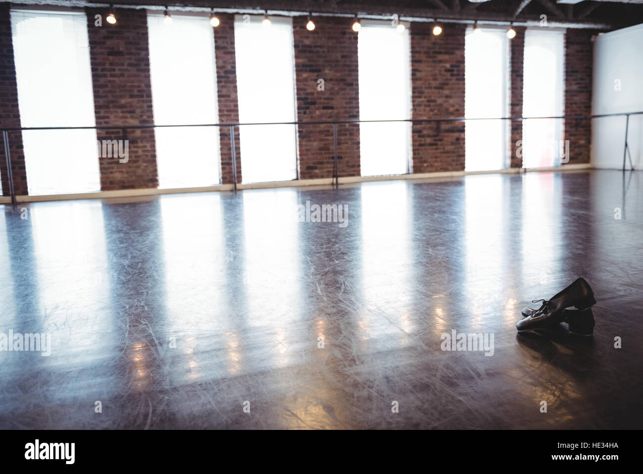 Pair Of Dancing Shoes On Wooden Floor In Dance Studio Stock