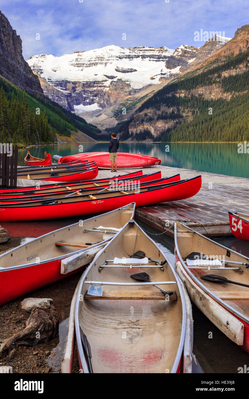 Red canoes for rent beside the dock at Lake Louise boat house in Banff