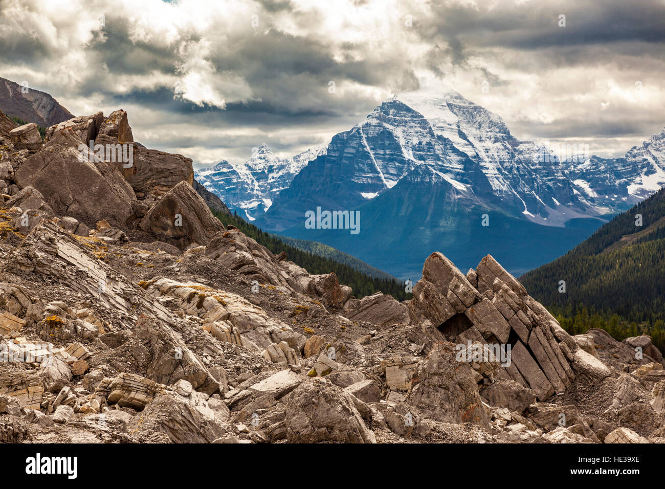 Mount Temple pierces the storm clouds along the Baker Creek trail in