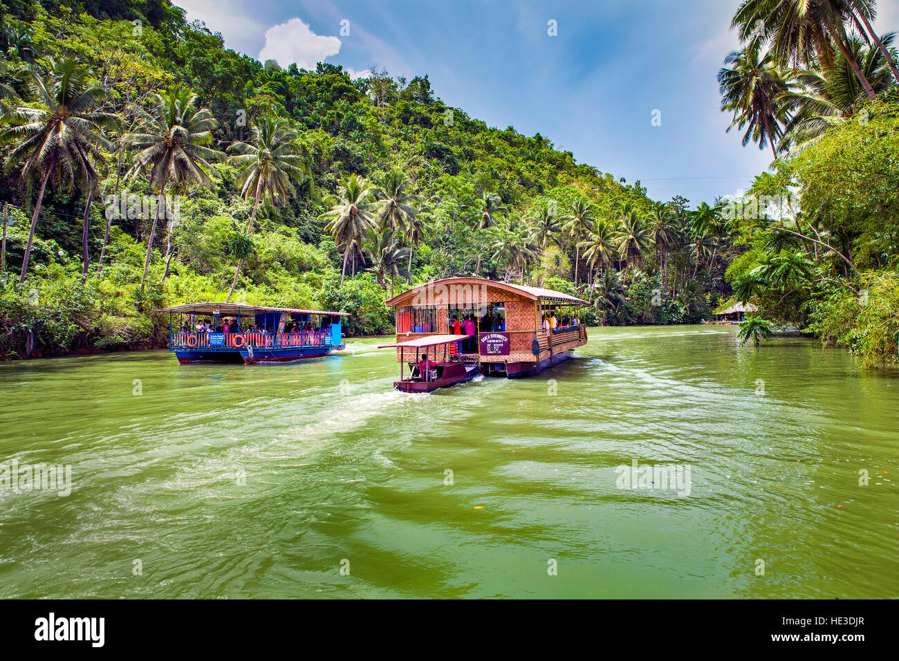 Tourists experience a dinner sightseeing cruise on the Loboc River on Bohol Island, Philippines, Southeast Asia. Stock Photo