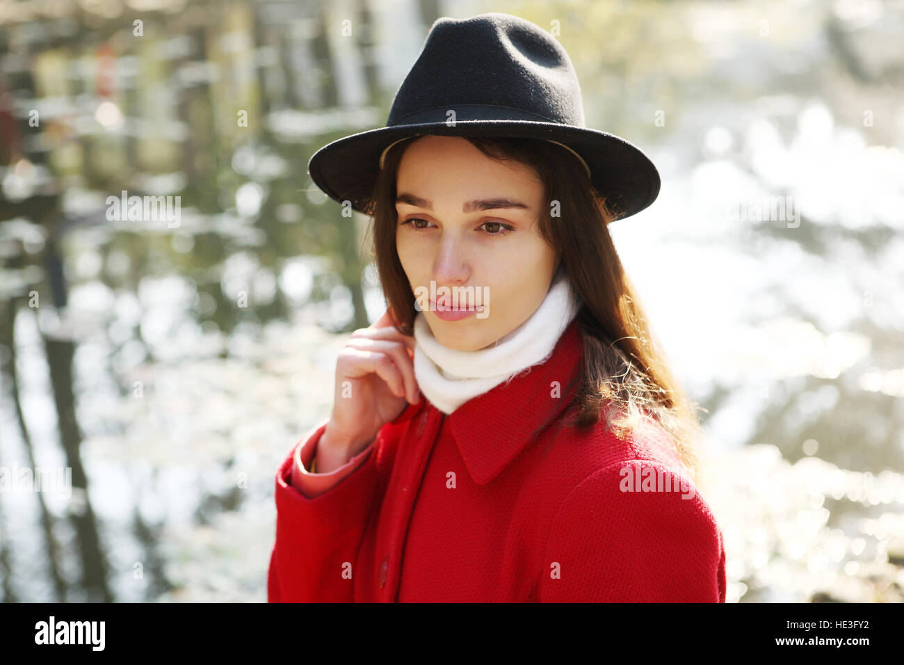 Girl in a black hat for a walk in the autumn park Stock Photo - Alamy