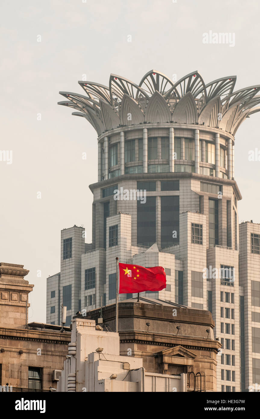 The Chinese national flag and Bund Center building , Shanghai, China. Stock Photo