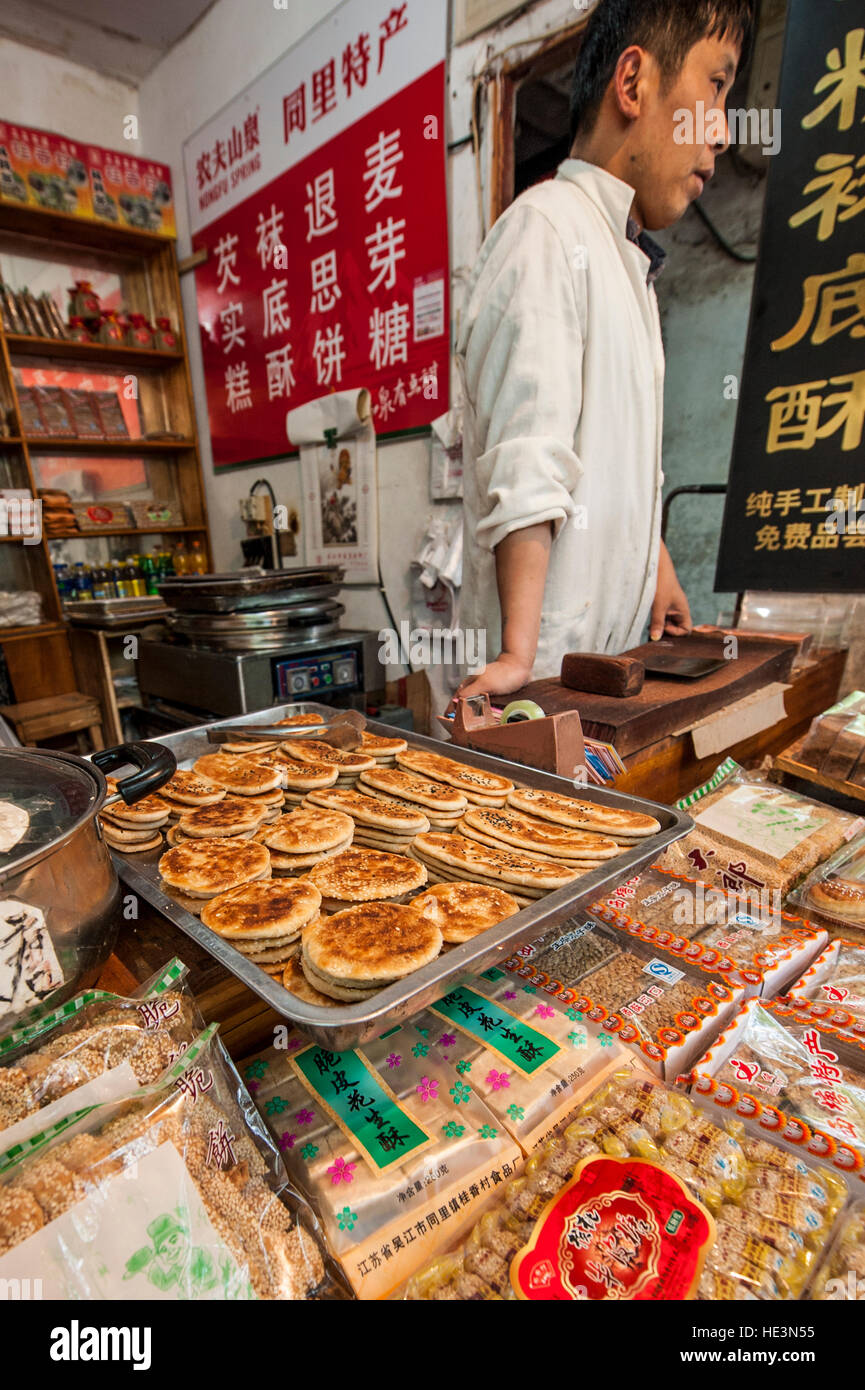 Vendor with flat bread in market in the water village of Tongli, China. Stock Photo