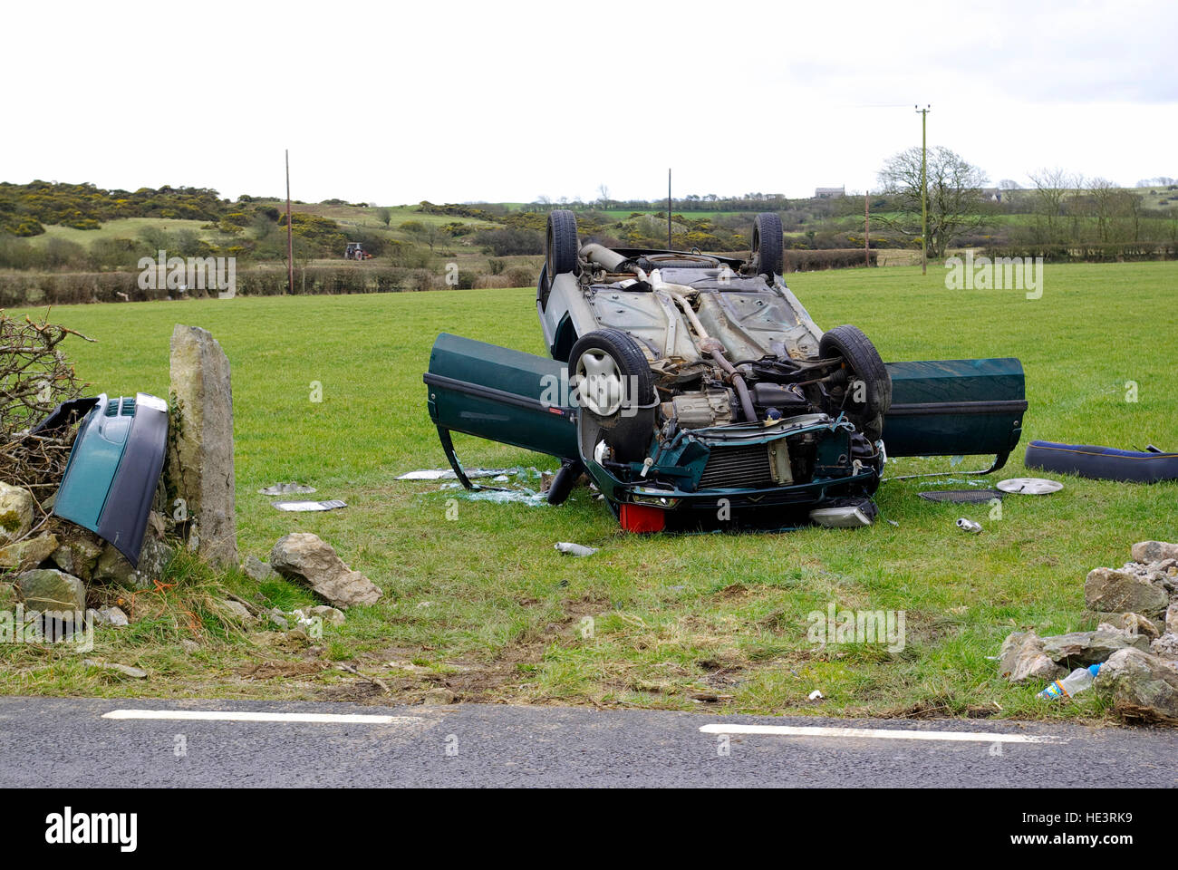 Crashed Car in field, Anglesey, North Wales, United Kingdom, Stock Photo