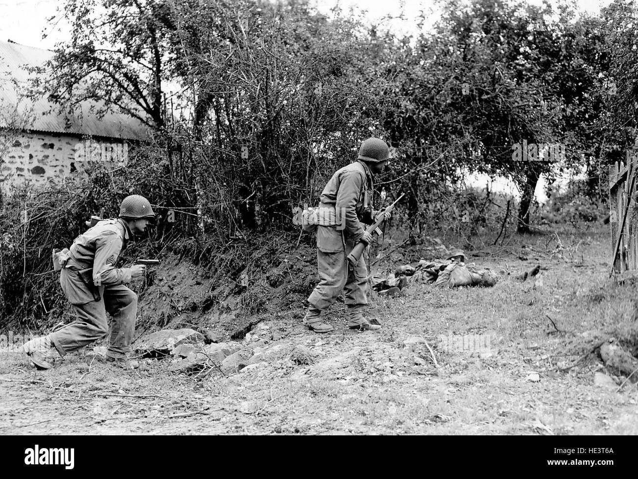 Normandy, France, June 1944. Allied soldiers fighting in the countryside and in the villages of Normandy. World War II Stock Photo