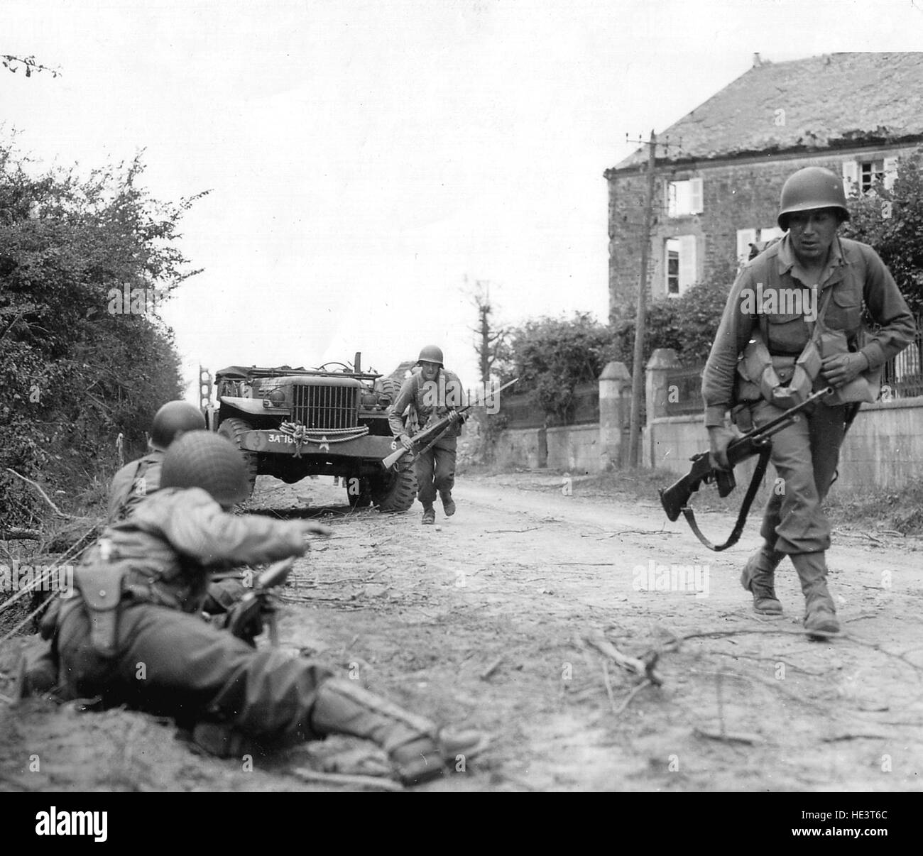 Normandy, France, June 1944. Allied soldiers fighting in the countryside and in the villages of Normandy. World War II Stock Photo